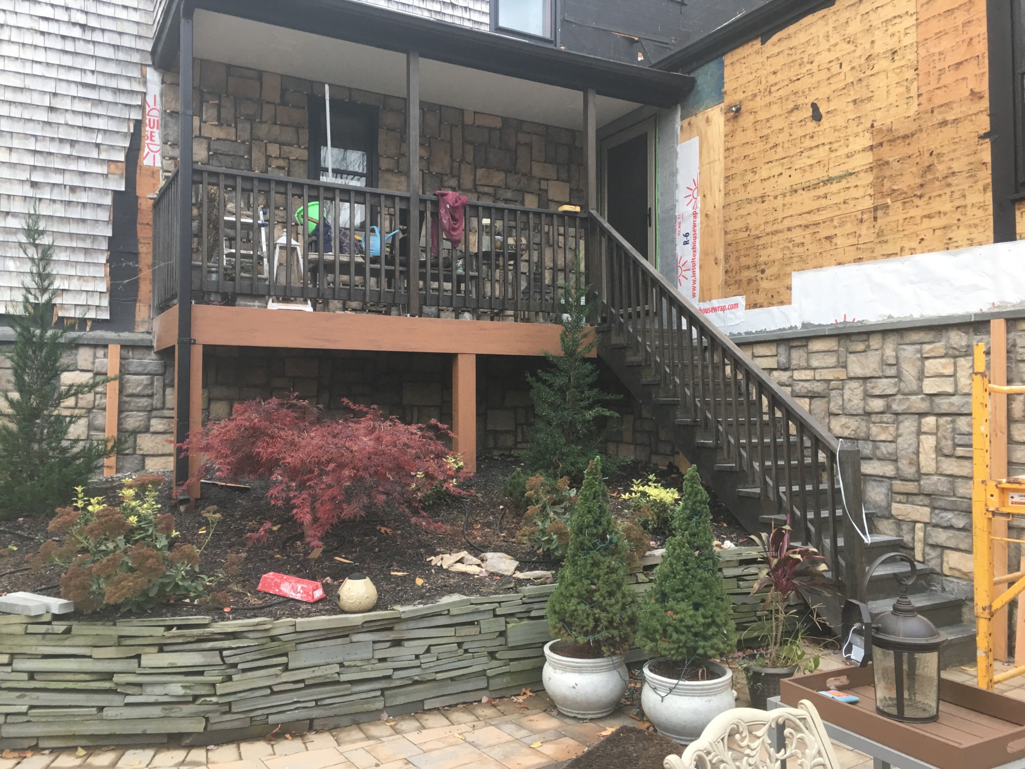 stone patio with retaining wall